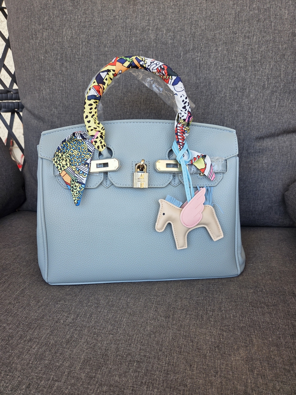 Light Blue Top-Handle Bag with Gold Hardware and Pink Horse Charm